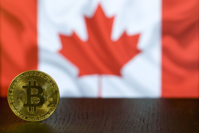 Golden Bitcoin coin displayed in front of a blurred Canadian flag symbolizing cryptocurrency in Canada. Golden Bitcoin coin displayed in front of a blurred Canadian flag symbolizing cryptocurrency in Canada.