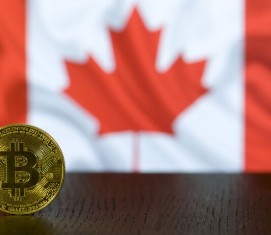 Канада открыла онлайн-продление паспорта для всех взрослых заявителей Golden Bitcoin coin displayed in front of a blurred Canadian flag symbolizing cryptocurrency in Canada.