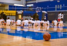 Group of teens at a basketball training session on an indoor court in Victoria, BC.