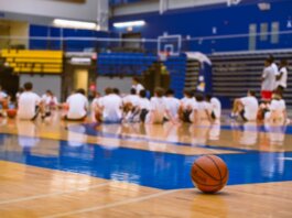 Group of teens at a basketball training session on an indoor court in Victoria, BC.