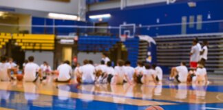 Group of teens at a basketball training session on an indoor court in Victoria, BC.