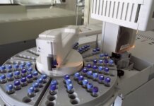 High-tech laboratory equipment with multiple vials in a scientific research facility.