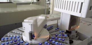 High-tech laboratory equipment with multiple vials in a scientific research facility.