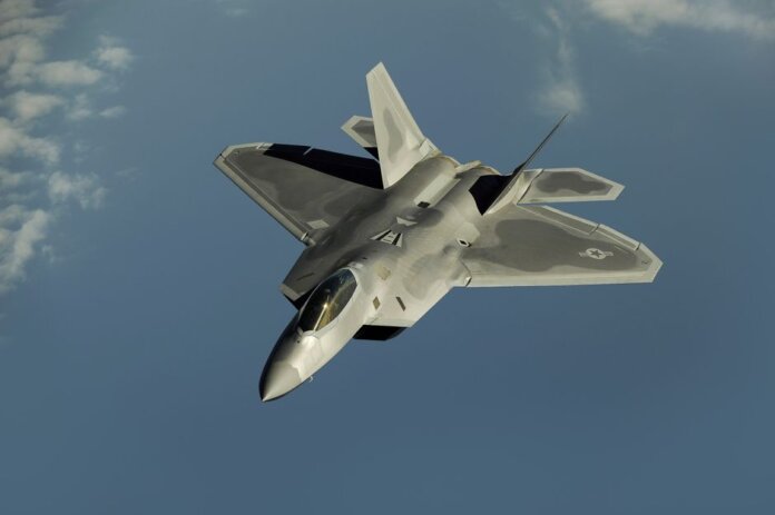 Powerful military aircraft soaring against a calm blue sky. Powerful military aircraft soaring against a calm blue sky.