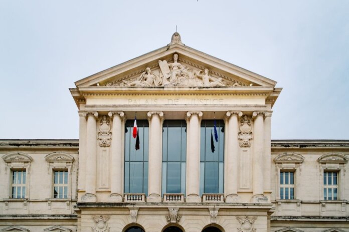 The historic Palais de Justice in Nice, showcasing classic French architectural design. The historic Palais de Justice in Nice, showcasing classic French architectural design.
