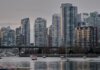 View of Vancouver's skyline featuring modern skyscrapers and boats on the water.