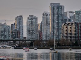 View of Vancouver's skyline featuring modern skyscrapers and boats on the water.