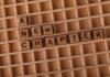 Cricket Canada ищет нового CEO: зарплата до $120 000 и возврат в ICC Wooden Scrabble letters arranged to spell 'A New Chapter' on a gridded board.