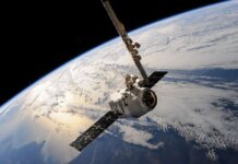 A satellite glides over Earth showcasing dramatic cloud formations and the vast expanse of space.