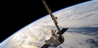 A satellite glides over Earth showcasing dramatic cloud formations and the vast expanse of space.