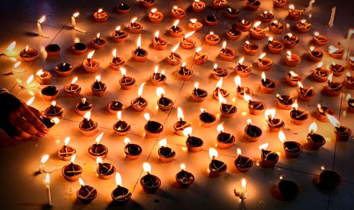 A vibrant collection of lit diyas symbolizing Diwali, the festival of lights, celebrating warmth and prosperity.