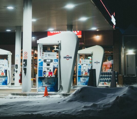 A well-lit gas station surrounded by snow during a winter night in St. John's, NL, Canada.