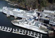 Aerial photo of large BC Ferries docked at a scenic coastal terminal