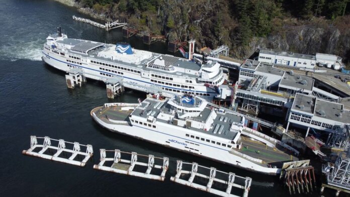 Aerial photo of large BC Ferries docked at a scenic coastal terminal