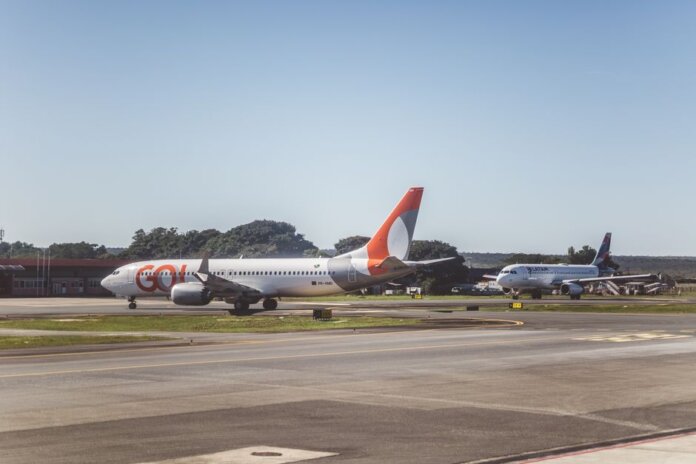 Airliners taxiing on a sunny day at an airport, ready for takeoff. Airliners taxiing on a sunny day at an airport, ready for takeoff.