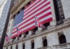 Министр финансов Шампань представит интересы Канады на встрече G20 в Северной Каролине American flag on a historic building exterior symbolizing patriotism and national pride.
