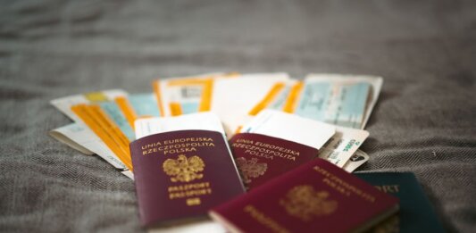 Close-up of Polish passports and travel tickets symbolizing travel and adventure.