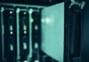 Зачем Meta строит дата-центры: глава инфраструктуры компании об основе для ИИ Close-up of server racks in a data center highlighting modern technology infrastructure.