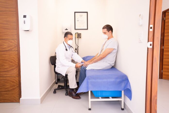 Doctor checking patient's vitals in a clinical setting for health consultation. Doctor checking patient's vitals in a clinical setting for health consultation.