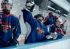 «Эдмонтон Ойлерз» вырвали победу у «Каролины» 6:5 по буллитам: по пять очков у Макдэвида и Драйзайтля Group of ice hockey players in blue jerseys celebrating a win indoors.