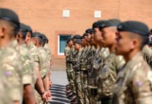 Gurkha recruits stand in formation at a British Army training facility in England.