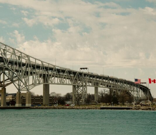 Iconic Blue Water Bridge spanning between the USA and Canada over clear waters.