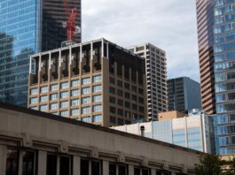 Modern skyscrapers with a construction crane in downtown Calgary, Alberta, Canada.