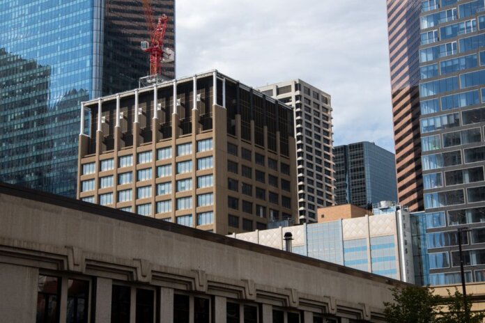 Modern skyscrapers with a construction crane in downtown Calgary, Alberta, Canada.