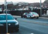 Полиция Гамильтона приостановила работу с Crime Stoppers после кибератаки Police car parked on asphalt road near modern vehicles in city district in evening