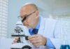 Учёные Western University нашли кремний в ядерном топливе TRISO ещё до реактора Scientist examining samples through a microscope in a modern laboratory setting.