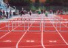 Оттава усиливает поддержку сборной Канады: новое финансирование спортивных институтов Women athletes compete in a hurdles race at a Victoria track event on a sunny day.